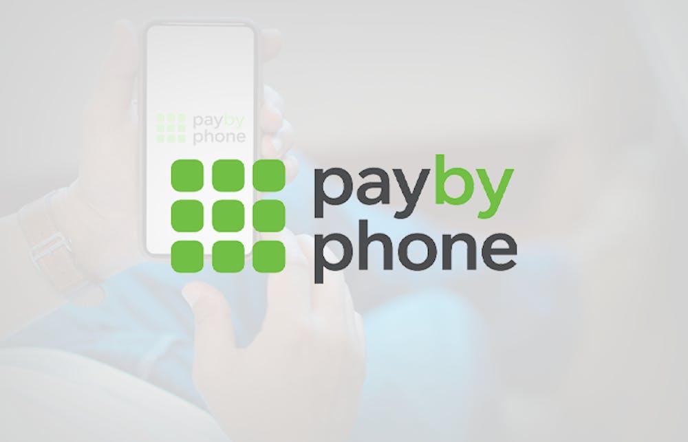 The Pay by Phone logo on a background showing a casino player making a deposit via mobile phone bill